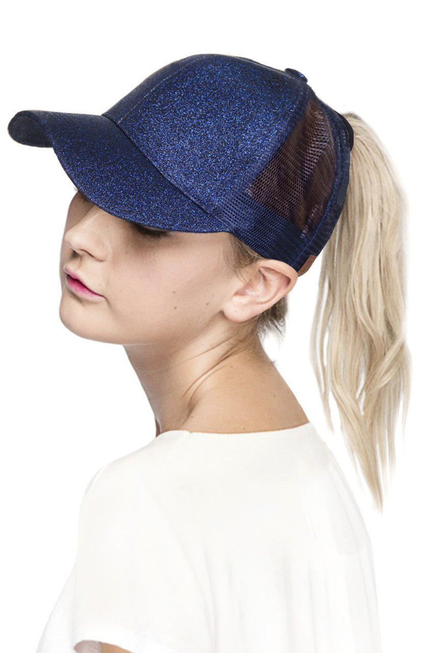 Navy C.C BASEBALL PONYCAP is a must-have accessory for any baseball fan. Made with high-quality materials, this cap offers both style and functionality. Featuring a ponytail holder, it allows for easy and comfortable wear while keeping your hair in place. Elevate your game day look with the C.C BASEBALL PONYCAP.