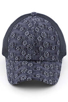 Navy C.C FLOWER EMBROIDERY EYELET CRISS CROSS PONYCAP features delicate flower embroidery and eyelet detailing, with a criss cross design for a chic and stylish look. Made with quality materials, this cap offers both fashion and functionality. Perfect for any casual or outdoor activity, it will keep you cool and covered.