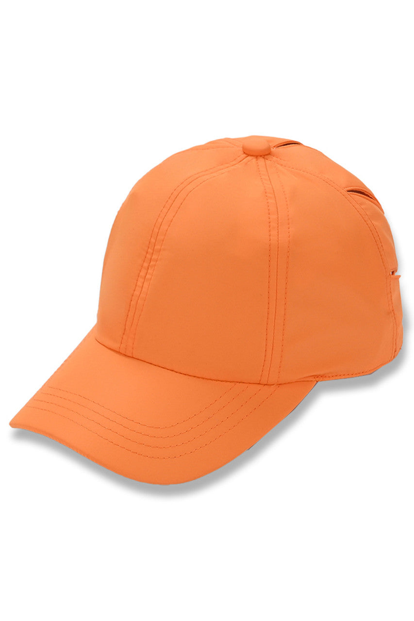 Orange C.C Sunshine Multi Opening Baseball Pony Cap is designed to provide maximum comfort and style. With multiple openings and a classic baseball cap design, it allows for versatile wear and is perfect for any outdoor activity. Made with high-quality materials, it offers a durable and fashionable accessory for everyday use.