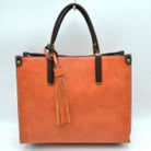 Orange Large Shoulder Vegan Leather Tassel Handbag For Women.&nbsp;High quality Vegan Leather is a luxurious and durable, Stay organized in style with this square-shaped shopper tote bag that is fully two contrasting interior and exterior solid colors. This vegan leather handbag includes an on-trend removable tassel embellishment. Guaranteed, This will be your go-to handbag.&nbsp;