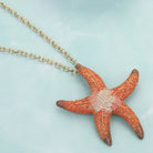 Coral, Gold Starfish Colored Metal Pendant Necklace