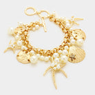 Gold, Matte gold Pearl embellished starfish shell multi charm toggle bracelet