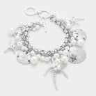 Matte Silver, Rhodium Pearl embellished starfish shell multi charm toggle bracelet