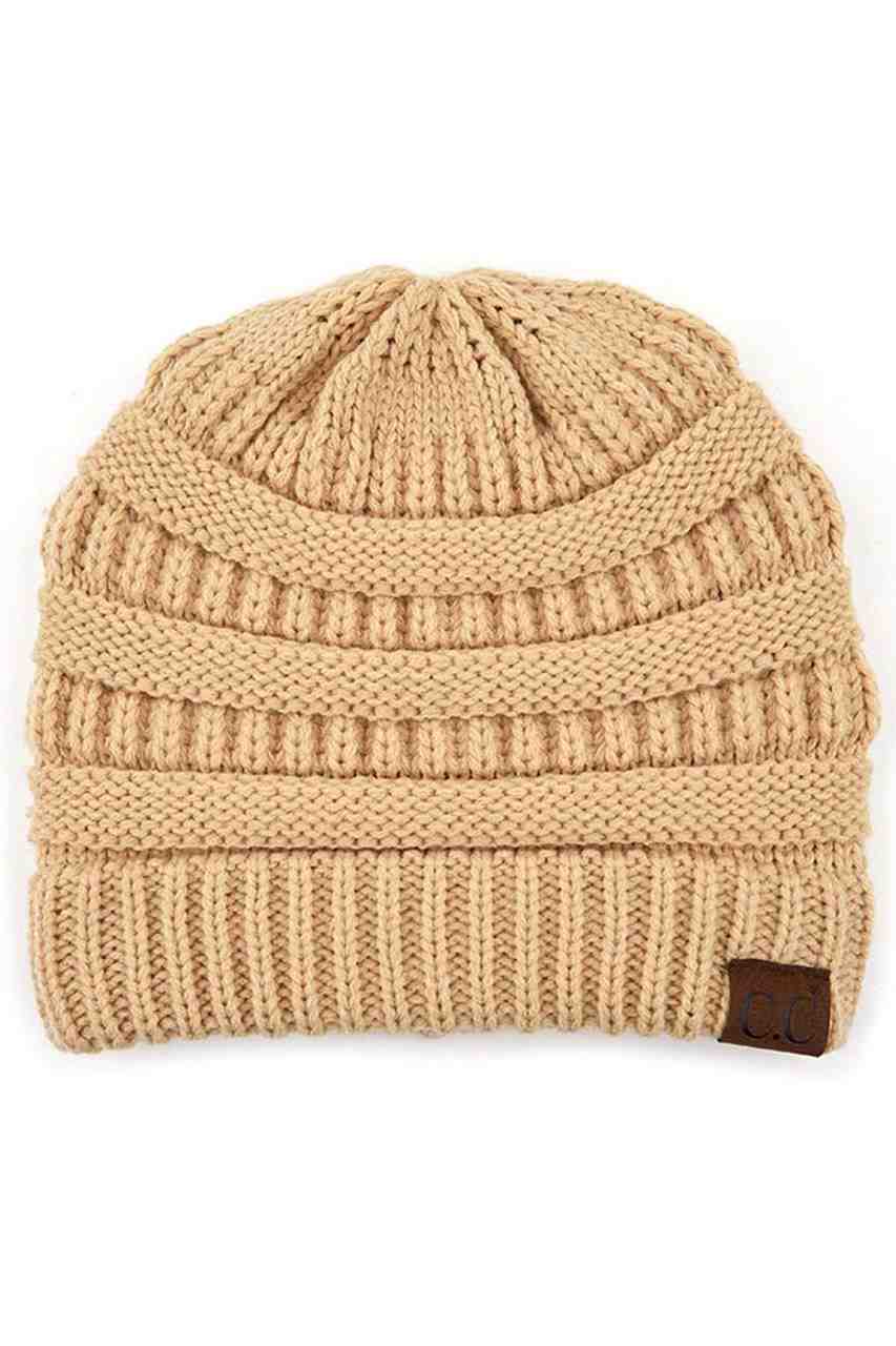 PeanutBeige C.C Ribbed Knit Solid Color Beanie offers a timeless design with durable ribbed knitting, ensuring a snug and comfortable fit. Crafted for warmth and versatility, this beanie is perfect for everyday wear, providing reliable protection against cold weather while maintaining a sleek, minimalist style that complements any outfit. Its solid color adds understated appeal, making it an essential accessory for both casual and outdoor use. 