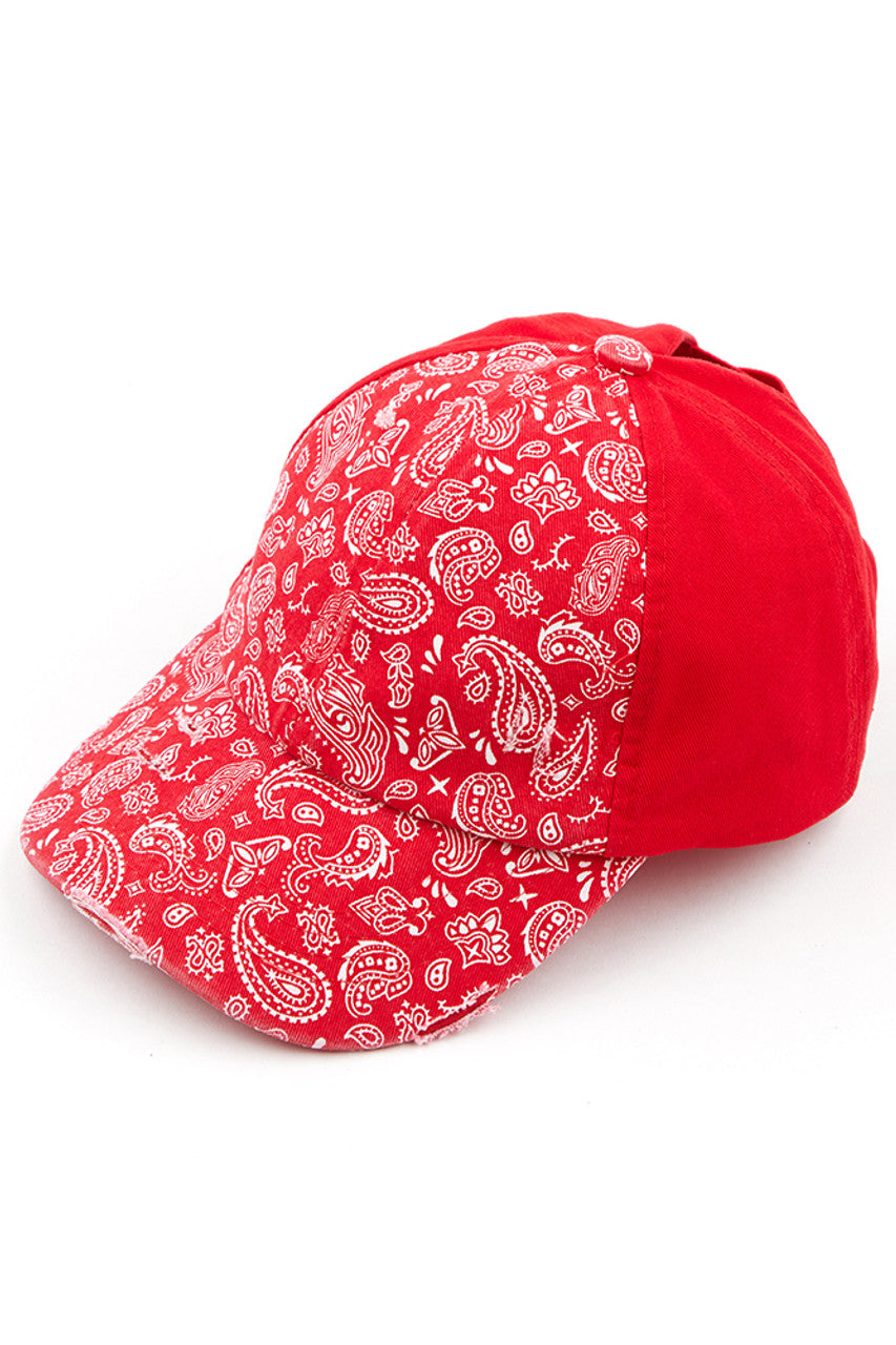 Red C.C Paisley Ponytail Baseball Cap is the perfect blend of style and functionality. Its unique design allows for a ponytail to be pulled through, keeping hair in place while also providing sun protection. Made with high-quality materials, this cap is a must-have for any fashion-forward and active individual.