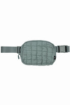 Sage C.C Quilted Puffer Fanny Pack is a stylish and functional accessory for any on-the-go individual. Made with durable quilted material, this fanny pack provides convenient storage for your essentials while remaining comfortable to wear. Perfect for travelers, runners, and outdoor enthusiasts.