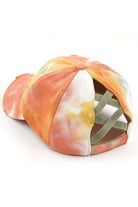 Sage C.C TIE DYE BASEBALL PONYCAP is a stylish addition to any outfit. Made with high-quality materials and a unique tie-dye design, it not only looks great but also offers protection from the sun. The adjustable ponytail hole allows for comfortable wear. Upgrade your style game with this must-have accessory.