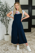 Suit Yourself Adjustable Strap Jumpsuit in Navy - Charming Charlie