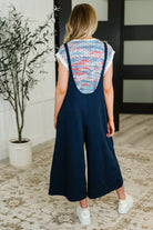Suit Yourself Adjustable Strap Jumpsuit in Navy - Charming Charlie