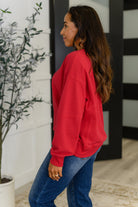 Sweet with a Side Eye Drop Shoulder Pullover in True Red - Charming Charlie