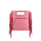 A square structured pink vegan leather crossbody bag with fringe on the side. 