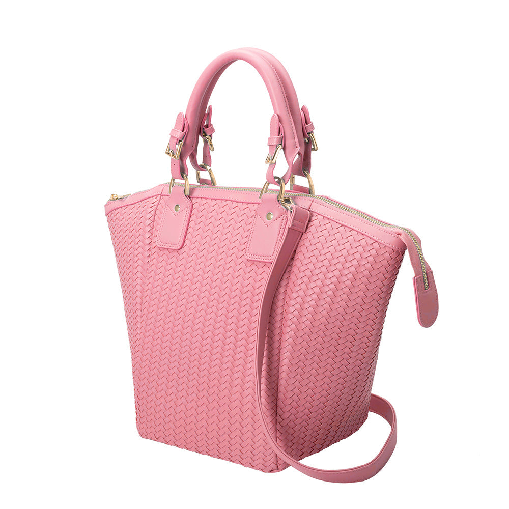 A large pink hand woven vegan leather tote bag.