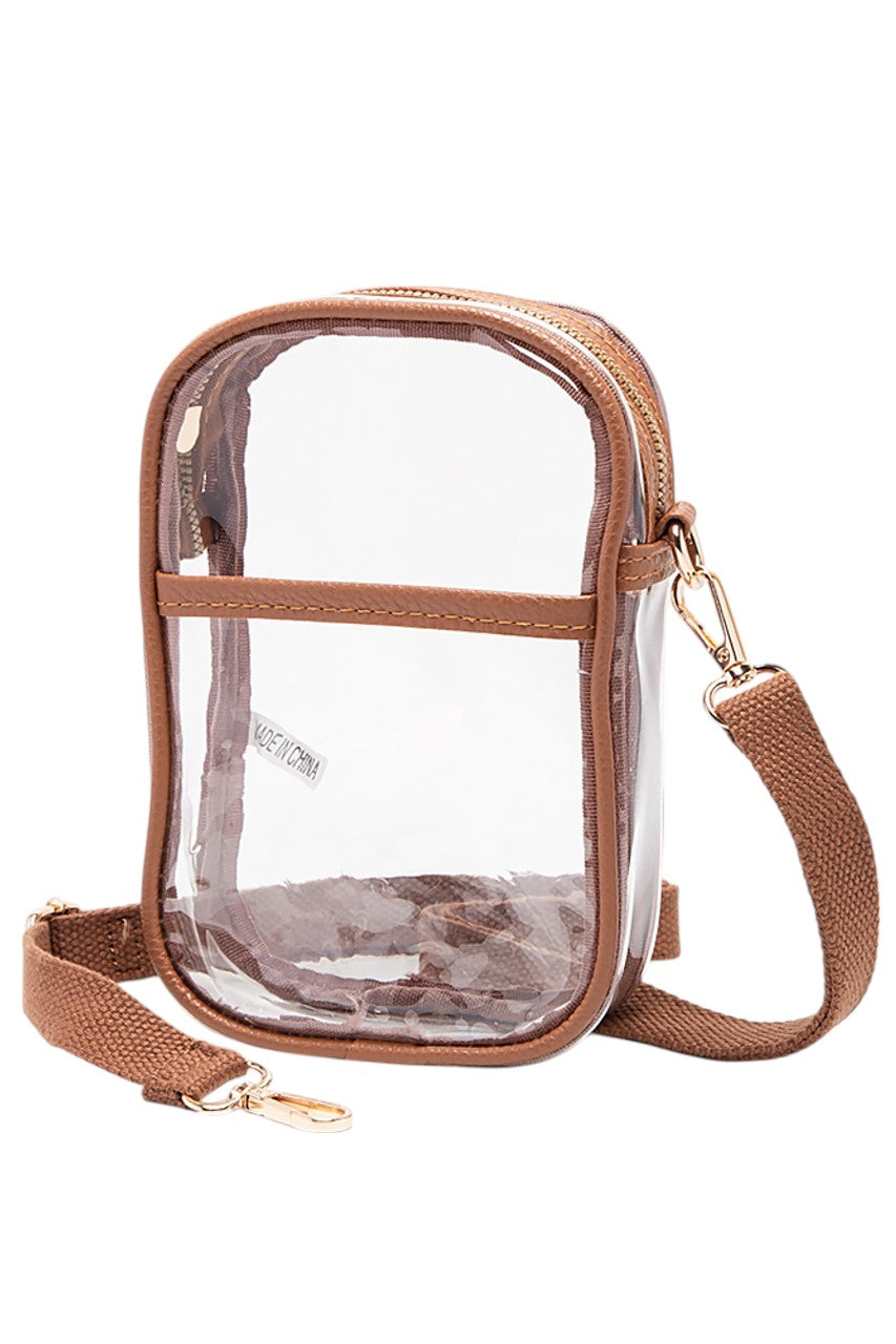 Tan Clear Crossbody Stadium Bag combines functionality with compliance, featuring a fully transparent design that meets most stadium security requirements. Its lightweight construction and adjustable crossbody strap provide comfort and ease of use, allowing quick access to your essentials while keeping them visible for hassle-free entry. Ideal for sports events, concerts, and venues with strict bag policies. 