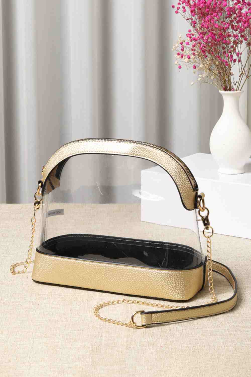 Gold Clear Stadium Concert Bag is expertly crafted to comply with most venue security policies, featuring a fully transparent design for easy inspection. Its durable, lightweight construction ensures convenience without bulk, while providing ample space for essentials such as tickets, phones, and wallets. Ideal for concert and sports fans, it combines security compliance with practical everyday use.