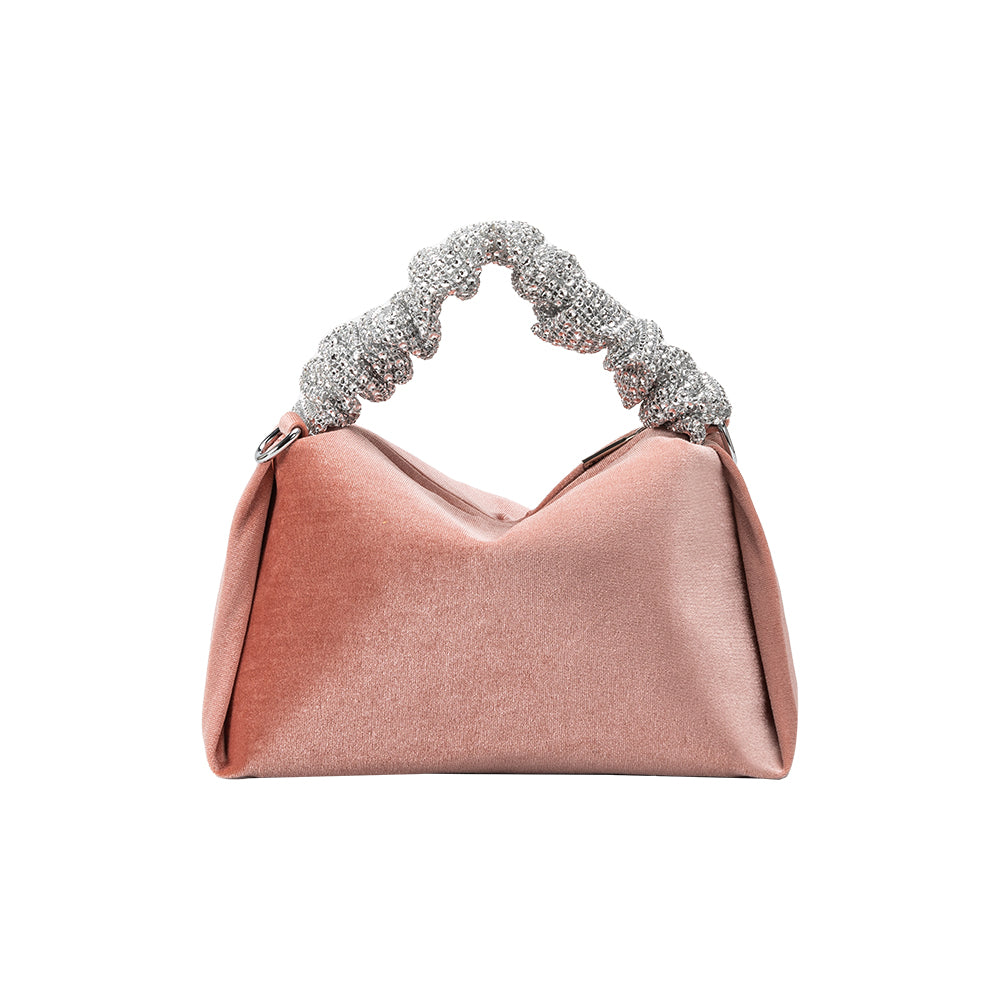A medium velvet blush top handle bag with silver encrusted handle. 