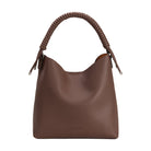 A chocolate pebble vegan leather tote bag with spiral handle. 