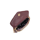 A small burgundy quilted vegan leather shoulder bag with gold M hardware. 