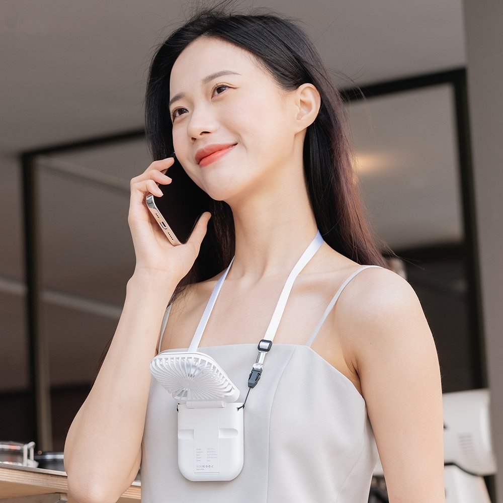 Wearing Portable Personal Fan & Talking On Phone- Multitasky