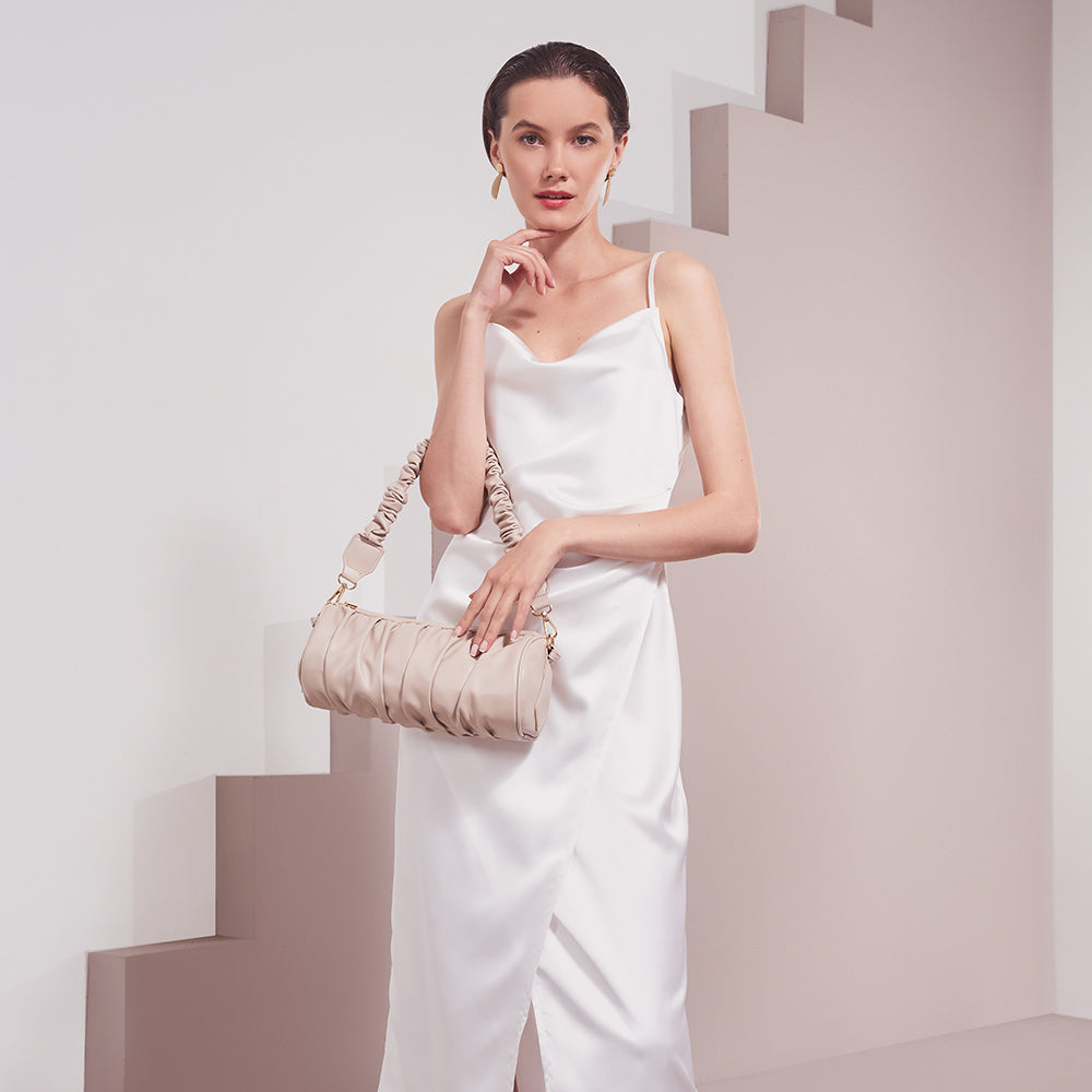 Model Wearing Melie Bianco Luxury Vegan Leather Jovie Shoulder Bag in Bone with ruched handle